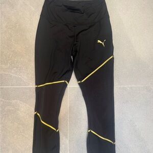 Puma Women’s Leggings in Black with Gold Highlights and mesh legs